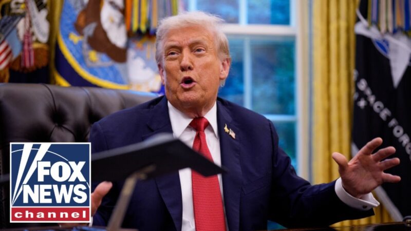 President Trump signs executive orders from the Oval Office